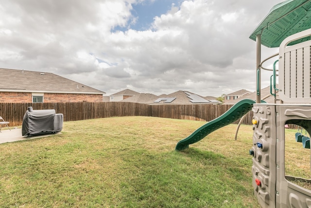 view of yard with a playground