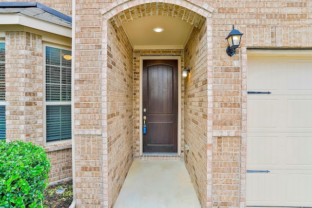 property entrance with a garage