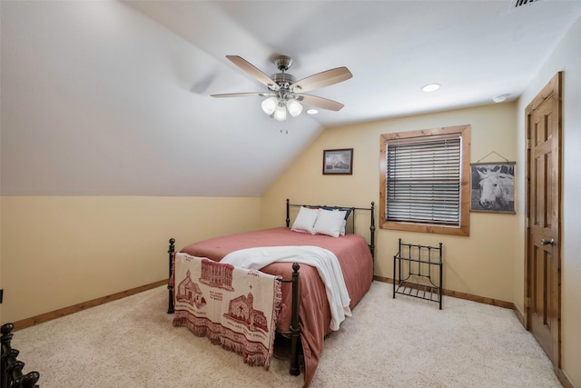 bedroom featuring baseboards, lofted ceiling, a ceiling fan, and carpet flooring