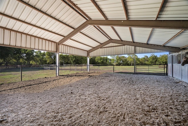 view of stable with a rural view