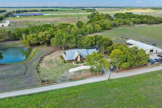 birds eye view of property featuring a rural view and a water view