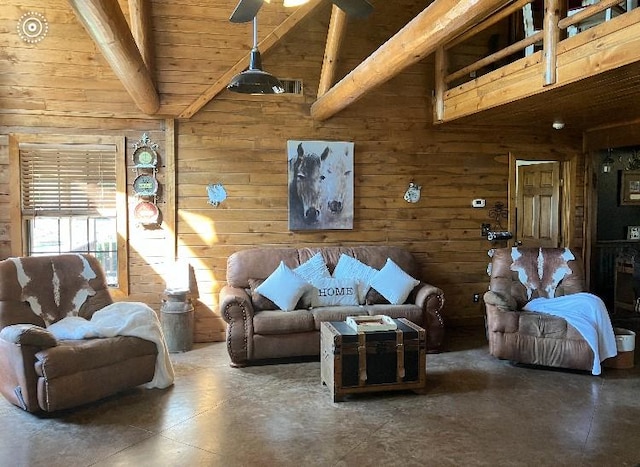 living room with beamed ceiling, ceiling fan, wooden walls, and wooden ceiling