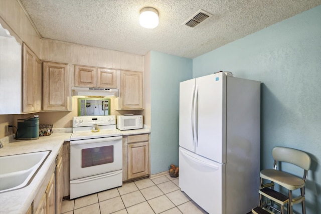 kitchen featuring white appliances, range hood, sink, and light brown cabinets