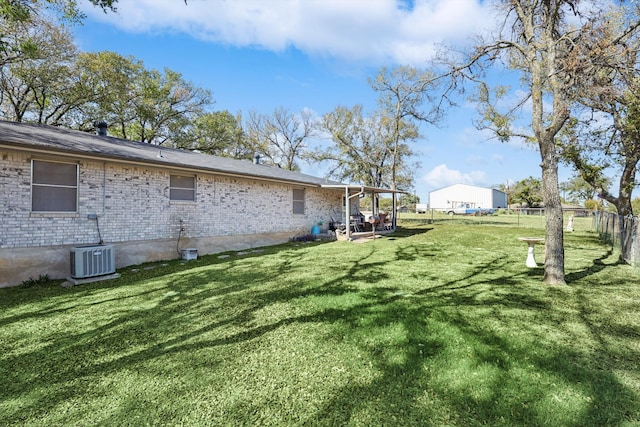 view of yard with central AC