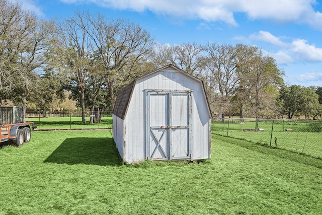 view of outbuilding featuring a lawn