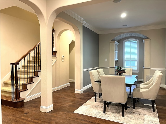 dining room featuring crown molding and dark wood-type flooring