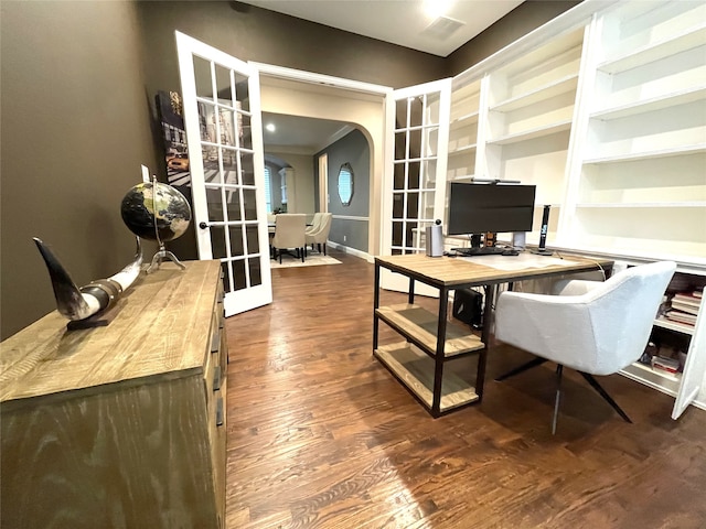 office space featuring french doors, ornamental molding, and dark hardwood / wood-style flooring