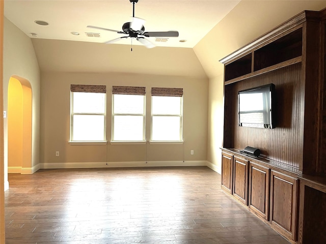 unfurnished living room with light hardwood / wood-style floors, lofted ceiling, and ceiling fan