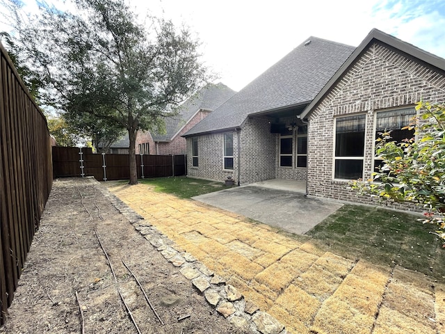 back of property featuring a patio area