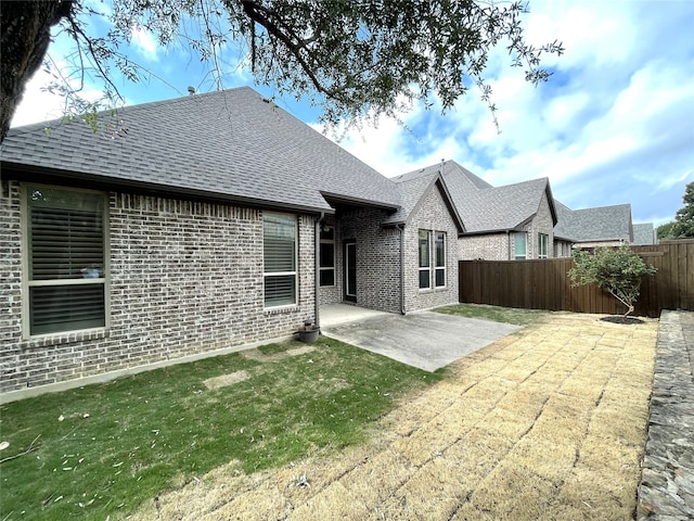 rear view of house featuring a patio