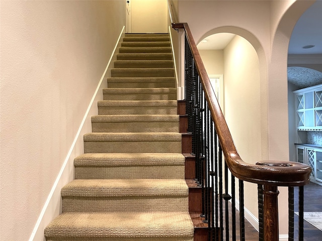 stairs with hardwood / wood-style flooring