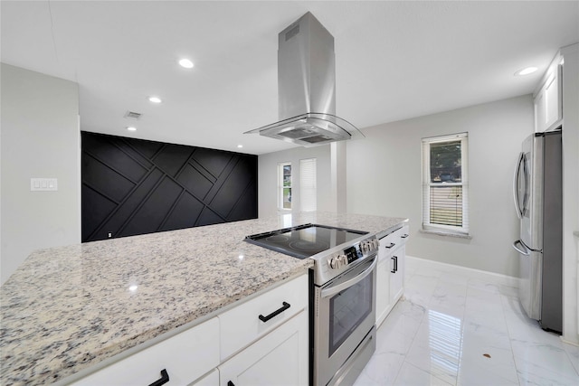 kitchen featuring white cabinets, light stone countertops, stainless steel appliances, and exhaust hood