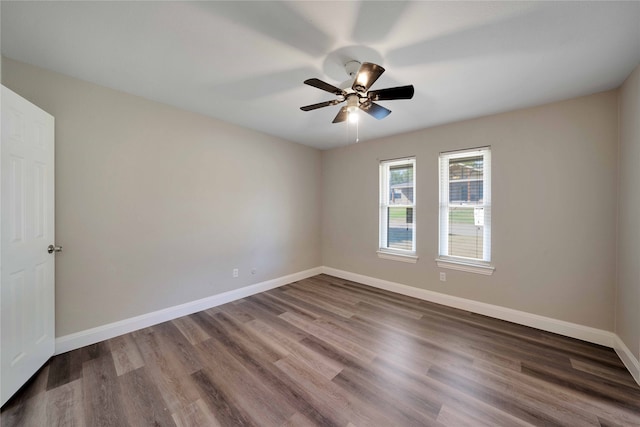 empty room featuring hardwood / wood-style floors and ceiling fan