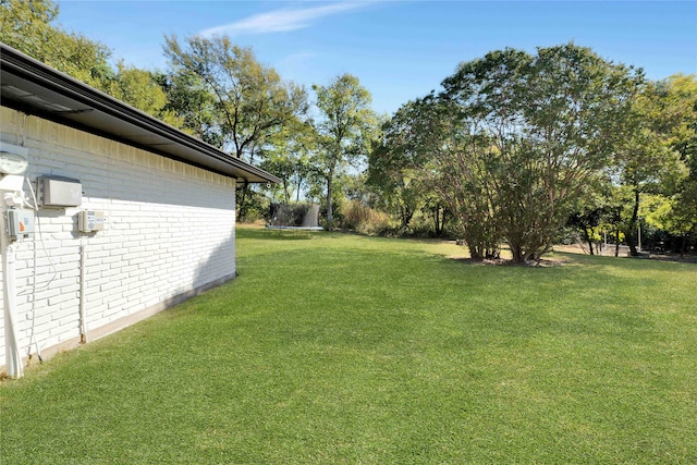 view of yard with a trampoline