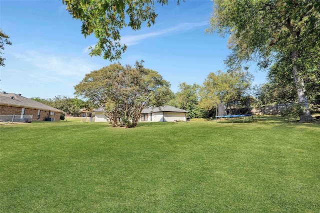 view of yard featuring a trampoline