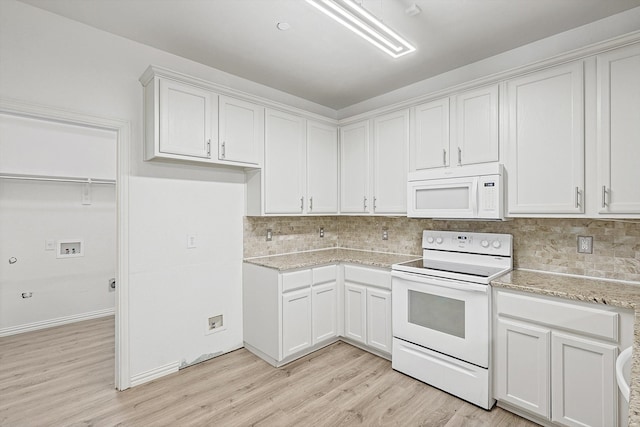 kitchen featuring decorative backsplash, white cabinets, light hardwood / wood-style flooring, and white appliances