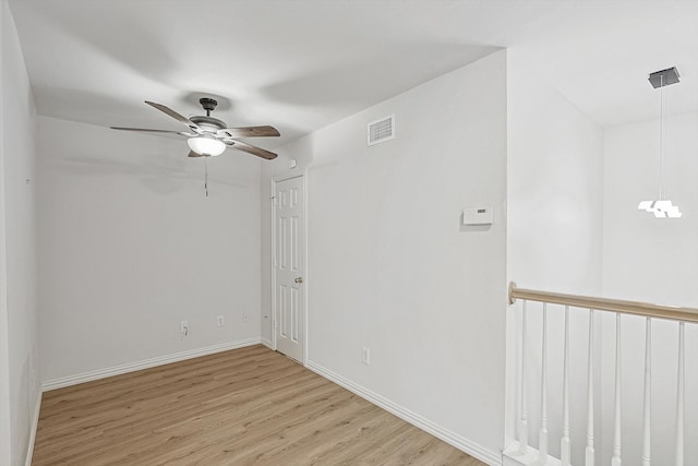 empty room featuring light hardwood / wood-style floors and ceiling fan