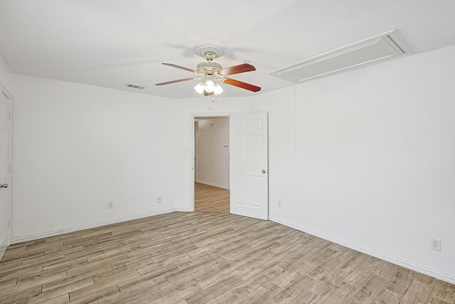 empty room with light hardwood / wood-style flooring and ceiling fan