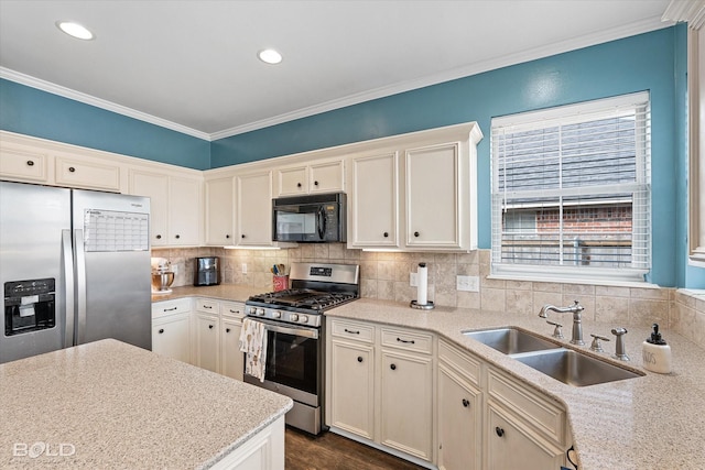 kitchen featuring sink, light stone counters, ornamental molding, appliances with stainless steel finishes, and backsplash