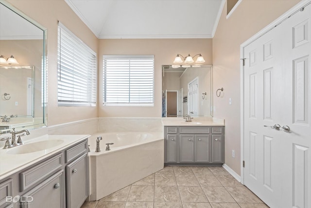 bathroom featuring vanity, a bathtub, vaulted ceiling, and ornamental molding