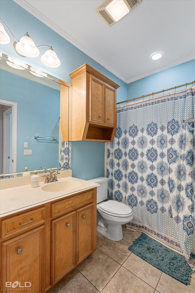 bathroom with ornamental molding, toilet, tile patterned flooring, and vanity