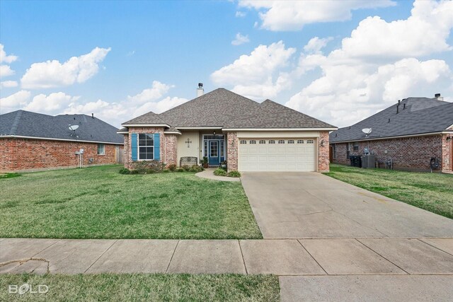 view of front facade with a garage and a front lawn