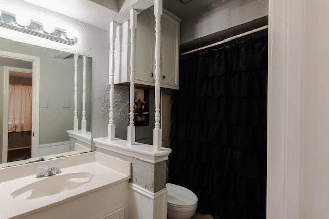 bathroom with vanity and toilet