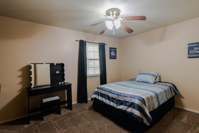 bedroom with dark carpet and ceiling fan