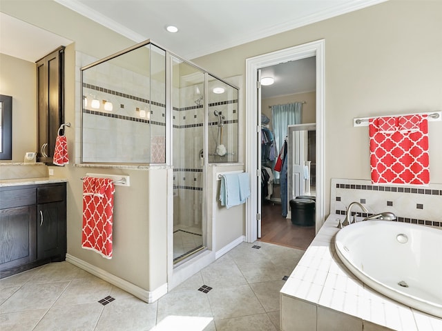 bathroom featuring vanity, ornamental molding, tile patterned flooring, and plus walk in shower