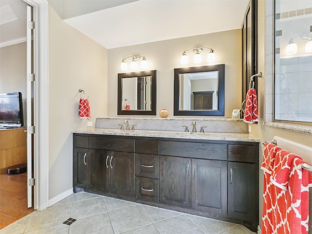 bathroom with vanity, crown molding, and tile patterned floors