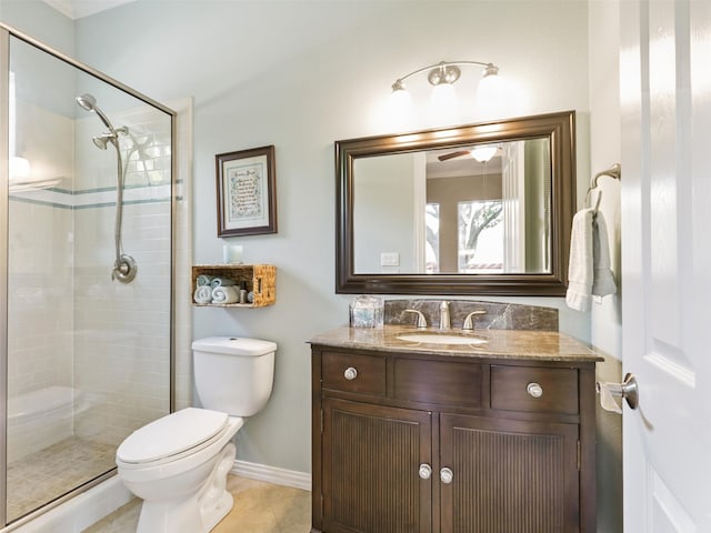 bathroom featuring vanity, tile patterned floors, toilet, and walk in shower