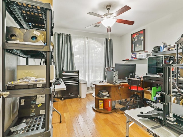 office area with hardwood / wood-style floors and ceiling fan