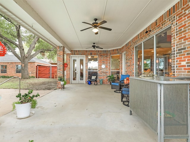 view of patio featuring french doors and ceiling fan