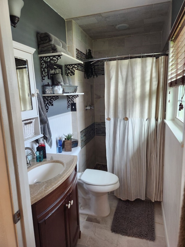 bathroom with vanity, toilet, and a shower with curtain