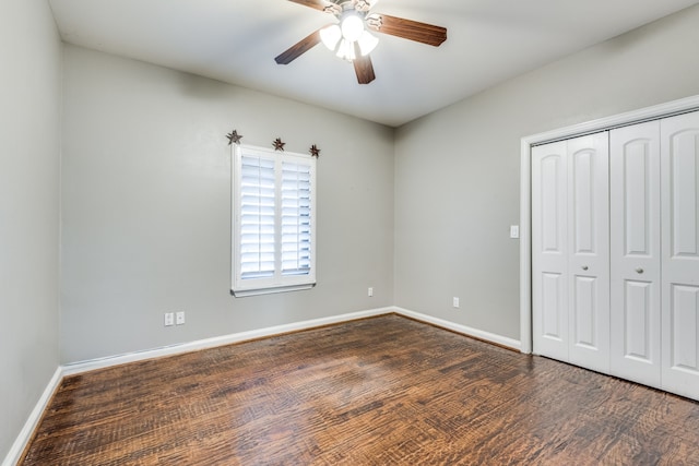 unfurnished bedroom with a closet, ceiling fan, and dark hardwood / wood-style flooring