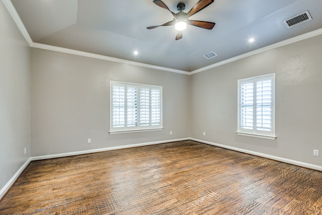 empty room with crown molding and dark wood-type flooring