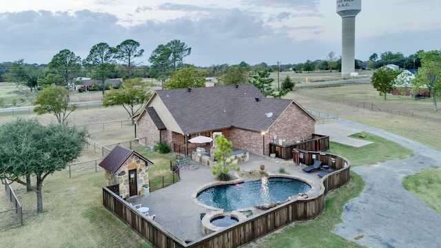 view of swimming pool featuring a patio area and a yard