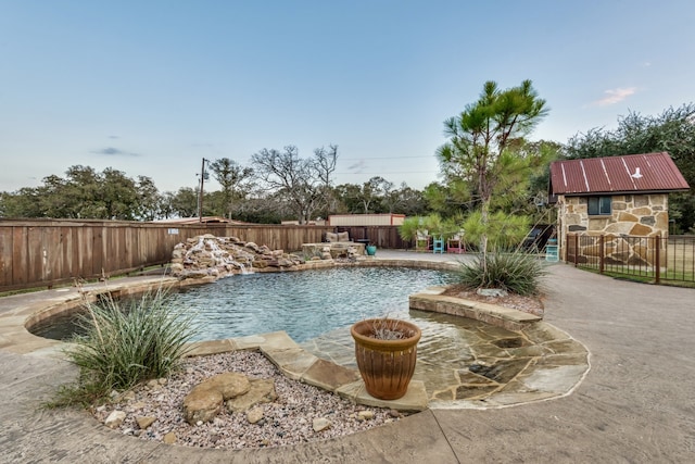 view of pool featuring a patio and pool water feature