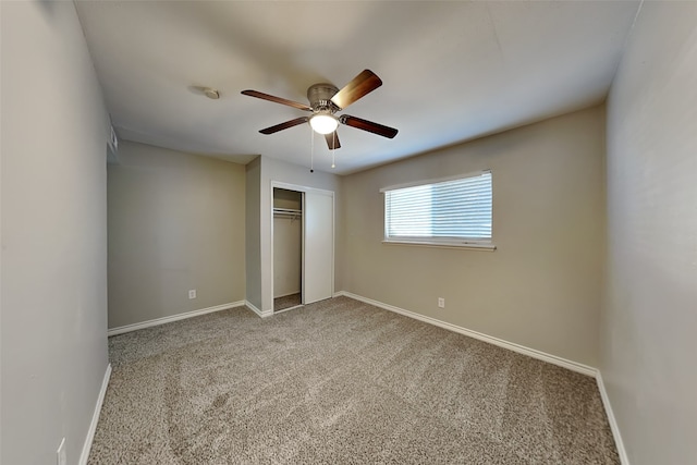 unfurnished bedroom featuring carpet, a closet, and ceiling fan