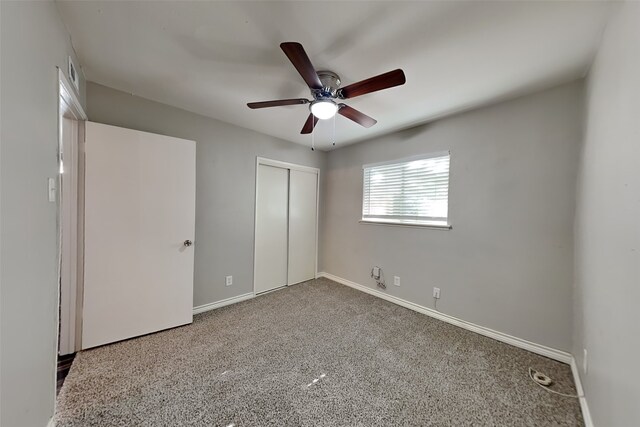 unfurnished bedroom featuring carpet flooring, a closet, and ceiling fan