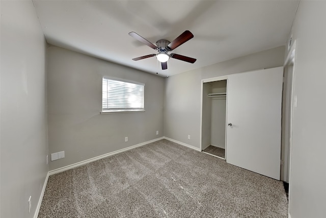 unfurnished bedroom with a closet, ceiling fan, and carpet