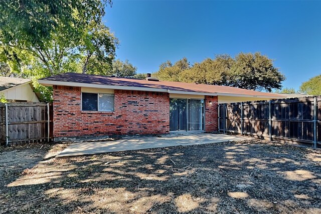 rear view of house featuring a patio