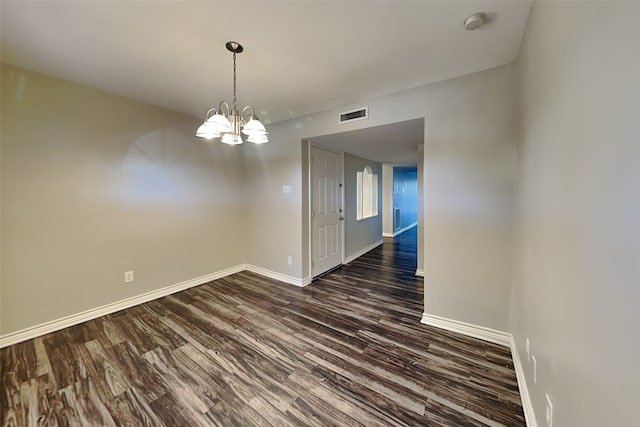 unfurnished dining area with dark hardwood / wood-style floors and a chandelier