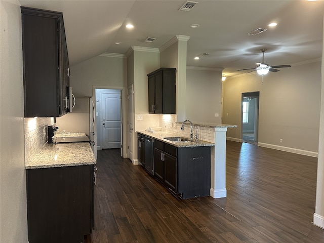 kitchen featuring light stone countertops, sink, stainless steel appliances, dark wood-type flooring, and ornamental molding