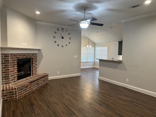 unfurnished living room featuring crown molding, dark wood-type flooring, and a brick fireplace