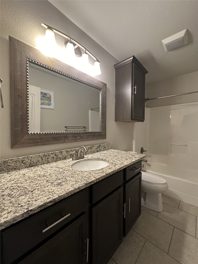 full bathroom with vanity, toilet, shower / washtub combination, and tile patterned flooring