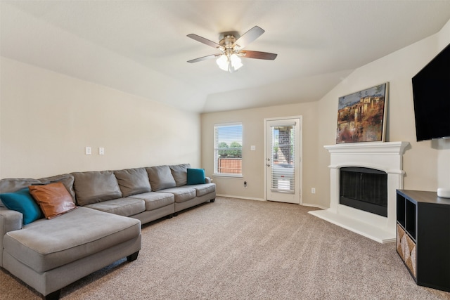 living room with vaulted ceiling, carpet, and ceiling fan