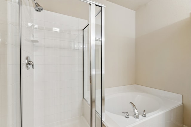 bathroom with shower with separate bathtub