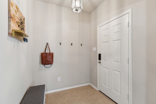 entryway with light tile patterned floors