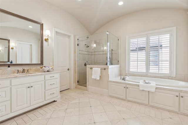 bathroom featuring vanity, tile patterned floors, separate shower and tub, and vaulted ceiling